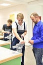 Group of young people in technical vocational training with teacher Royalty Free Stock Photo