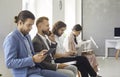 Group of young people waiting in line for a job interview or business appointment Royalty Free Stock Photo