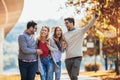 Young people walking through park. Friends having fun outdoor Royalty Free Stock Photo