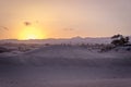 Group of young people watching sunset in the Maspalomas dunes, G Royalty Free Stock Photo