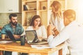 Group of young people work together. Brainstorming, teamwork, startup, business planning. Students learning online Royalty Free Stock Photo