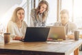 Group of young people work together.People work on laptops,discuss business plan,development strategy. Royalty Free Stock Photo