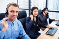 Group of young profession call center operator agent with headsets working in office. Business telemarketing service people Royalty Free Stock Photo