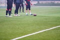 Group of american football players practicing football kickoff