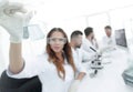 Group of young scientists working in the laboratory. Royalty Free Stock Photo