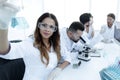 Group of young scientists working in the laboratory. Royalty Free Stock Photo