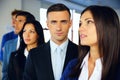 Group of a young serious businesspeople