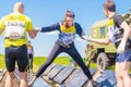 A group of young sport girl overcome the obstacles of the race of heroes competition. Text in Russian: Race of Heroes Royalty Free Stock Photo