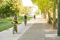 Group of young sportive boy riding bike on sunny day