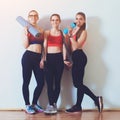 Group of young sporty girls in gym. Girls resting after fitness workout. Fitness, sport, healthy diet and lifestyle concept. Sport Royalty Free Stock Photo