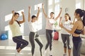 Group of young sporty girls in happy yes pose with coach, fitness club sportswomen Royalty Free Stock Photo