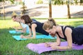 Group of young sporty people doing exercise outdoors Royalty Free Stock Photo