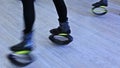 Group of young sporty women doing fitnes exercises with kangoo jumps shoes in a gym.