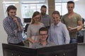 Group of young startup business people standing as team