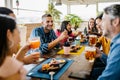 Group of young student friends having lunch together in coffee shop Royalty Free Stock Photo