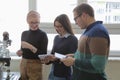 Group of young students  in technical vocational training with young female muslim teacher. Education and technology concept Royalty Free Stock Photo