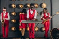 A group of young stylish people playing jazz at club Royalty Free Stock Photo