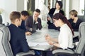 Group of young successful businessmen lawyers communicating together in a conference room while working on a project