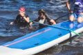 Group of young sup surfers fall from SUP stand up paddle board, women drowning, concept of fail solving problems, team work and Royalty Free Stock Photo