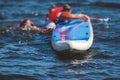 Group of young sup surfers fall from SUP stand up paddle board, women drowning, concept of fail solving problems, team work and Royalty Free Stock Photo