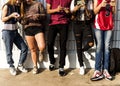Group of young teenager friends chilling out together using smartphone social media concept Royalty Free Stock Photo