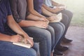 Young Teenages Studying the Bible Outside