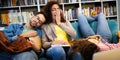Group of young tired students studying, learning for exam in library Royalty Free Stock Photo