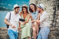 Group of young tourist friends with digital tablet Royalty Free Stock Photo