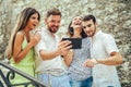 Group of young tourist friends with digital tablet Royalty Free Stock Photo