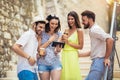 Group of young tourist friends with digital tablet Royalty Free Stock Photo