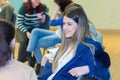 Group of young university girls students having a group discussion sitting together on a circle of chairs