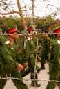 Young Vietnamese soldiers training behind barbed wire fence