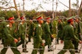 Young Vietnamese soldiers training behind barbed wire fence