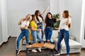 Group of young woman friends having party dancing at home Royalty Free Stock Photo