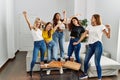 Group of young woman friends having party dancing at home Royalty Free Stock Photo