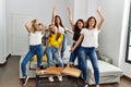 Group of young woman friends having party dancing at home Royalty Free Stock Photo