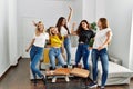 Group of young woman friends having party dancing at home Royalty Free Stock Photo