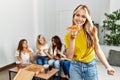 Group of young woman friends smiling happy eating pizza at home Royalty Free Stock Photo