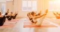 Group of happy middle aged women with fitness instructor, stretching in the gym before pilates, on a yoga mat near the Royalty Free Stock Photo