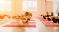 Group of happy middle aged women with fitness instructor, stretching in the gym before pilates, on a yoga mat near the Royalty Free Stock Photo