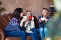 Group of women chatting while drinking coffee at modern loft Royalty Free Stock Photo