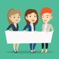Group of young women holding white blank board. Royalty Free Stock Photo