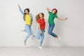 Group of young women in jeans and colorful t-shirts Royalty Free Stock Photo