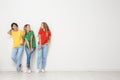 Group of young women in jeans and colorful t-shirts Royalty Free Stock Photo