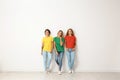 Group of young women in jeans and colorful t-shirts Royalty Free Stock Photo