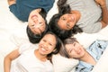 Group of young women lying in bed, happy and smiling, top view Royalty Free Stock Photo