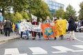 Group of Young Women Marching with Banner Against Climate Change