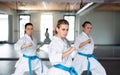 Group of young women practising karate indoors in gym. Royalty Free Stock Photo