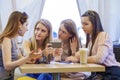 Group Of Young Women Sitting Around Table Eating Dessert Royalty Free Stock Photo