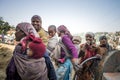 Group of young working mums carry infant on their back smile while doing work routine at construction site at Shimla district, Him Royalty Free Stock Photo